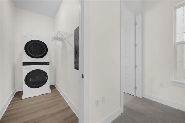 a view of a hallway with washer and dryer