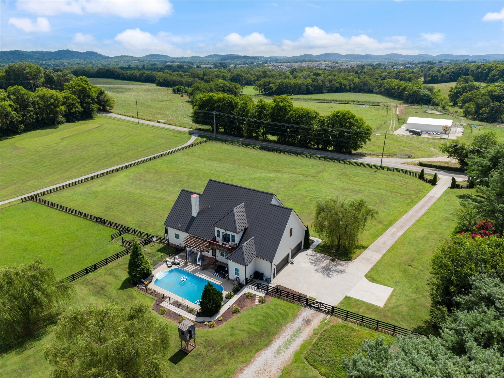 1779 Sedberry Road Franklin, TN 37064 - Photo 19 of 71 an aerial view of a house with a garden and lake view