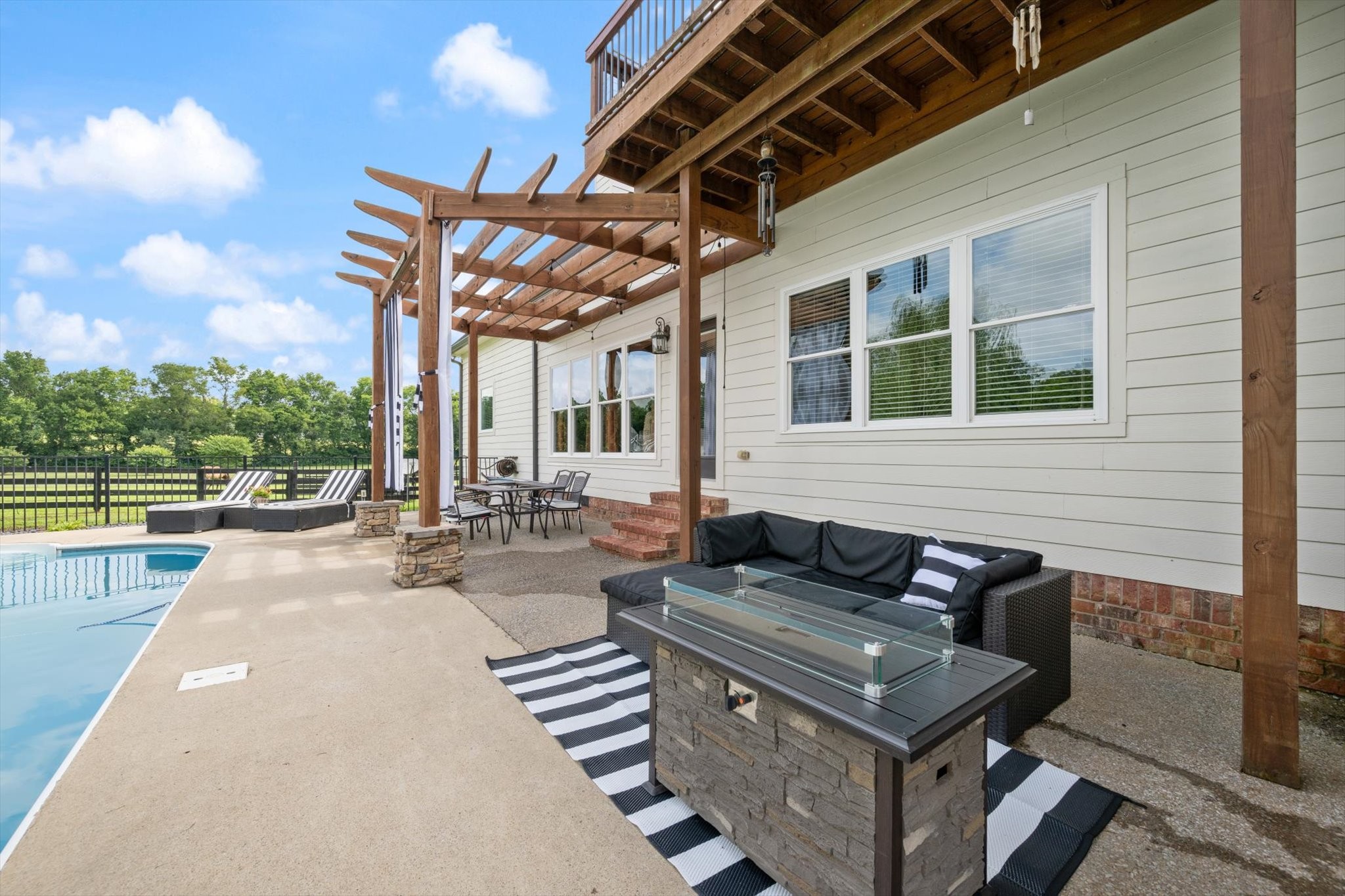 1779 Sedberry Road Franklin, TN 37064 - Photo 23 of 71 a view of a patio with couches table and chairs and potted plants