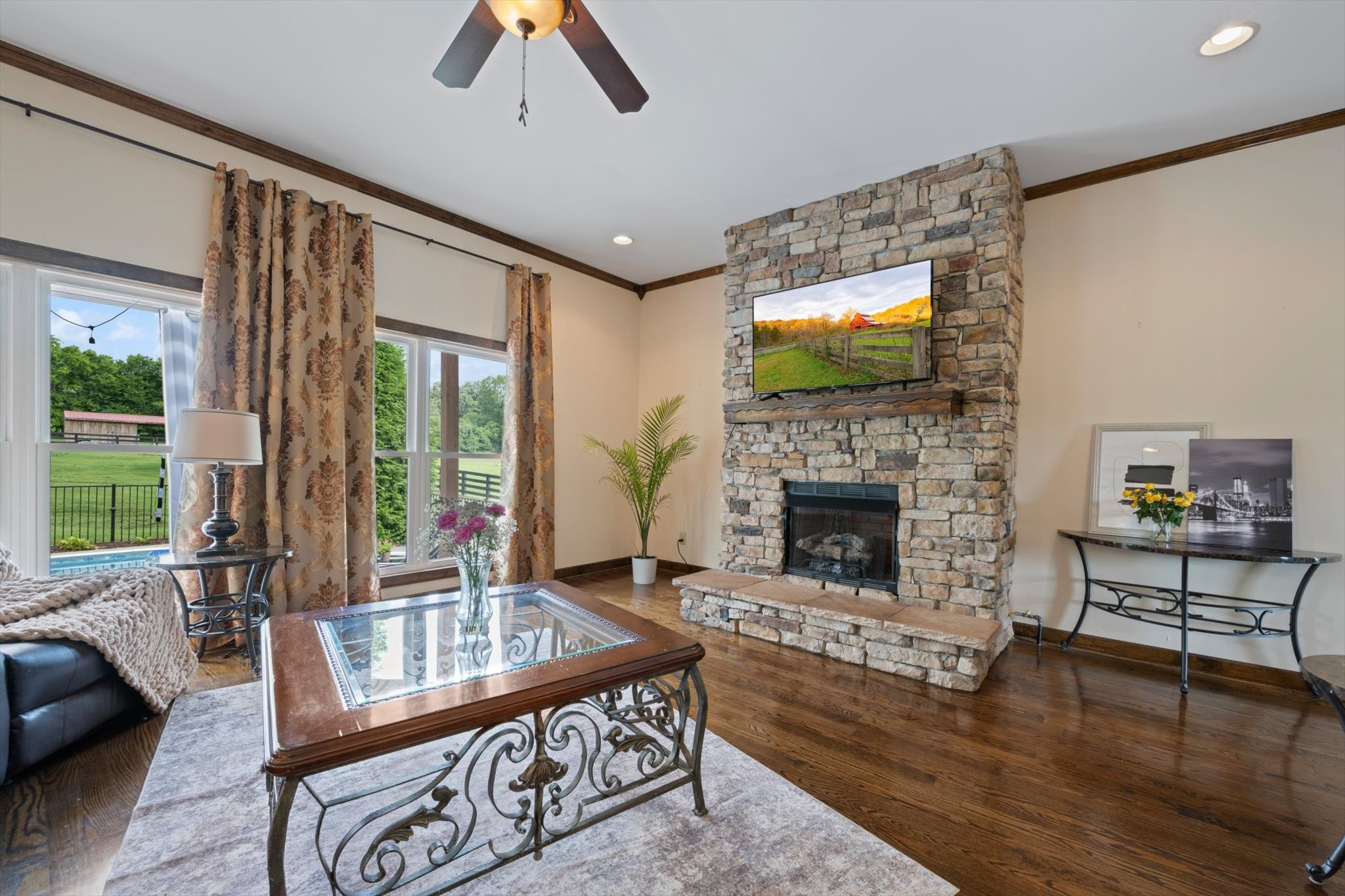 1779 Sedberry Road Franklin, TN 37064 - Photo 34 of 71 a living room with furniture a fireplace and a flat screen tv