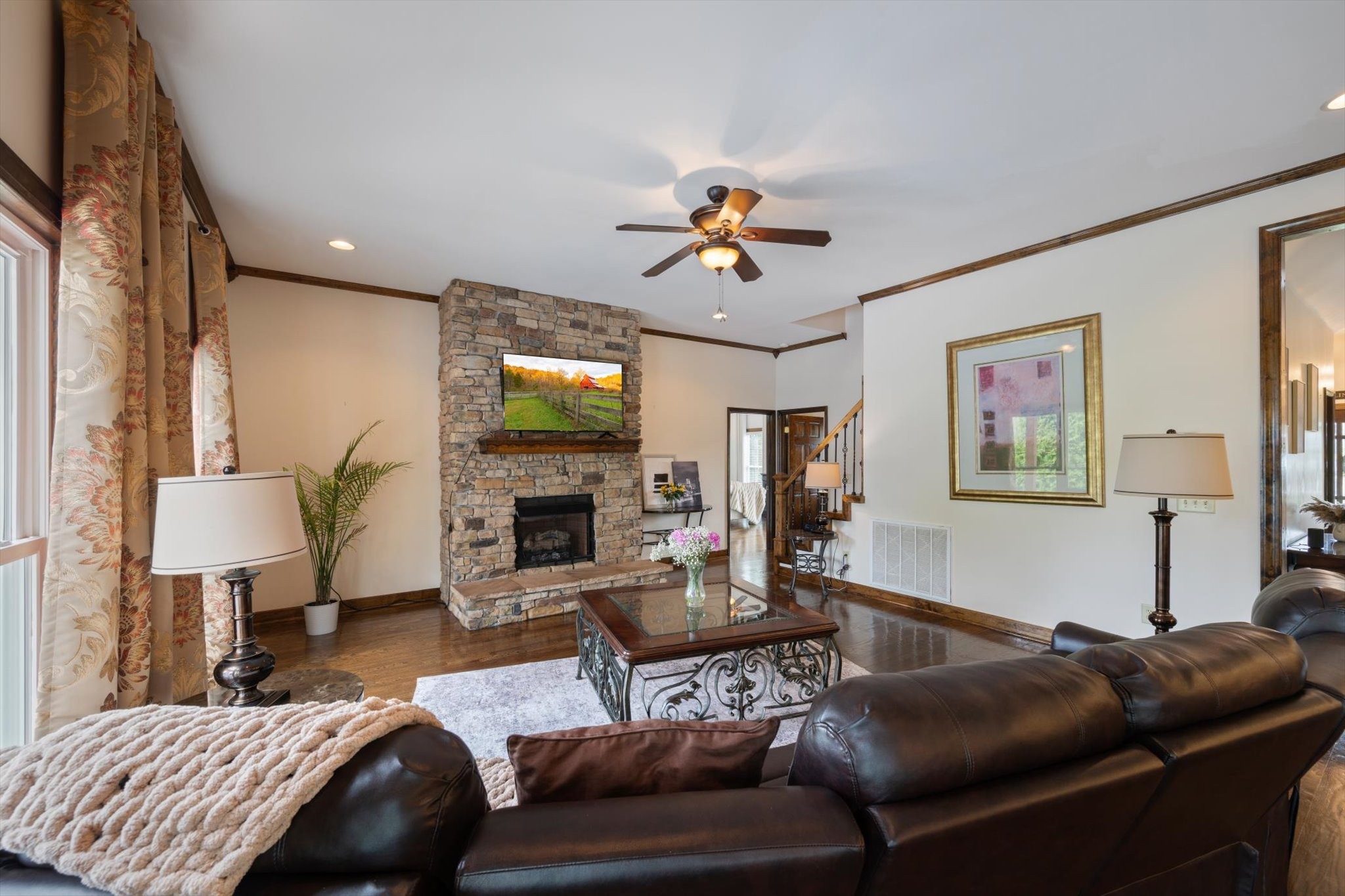 1779 Sedberry Road Franklin, TN 37064 - Photo 38 of 71 a living room with furniture a fireplace and a flat screen tv