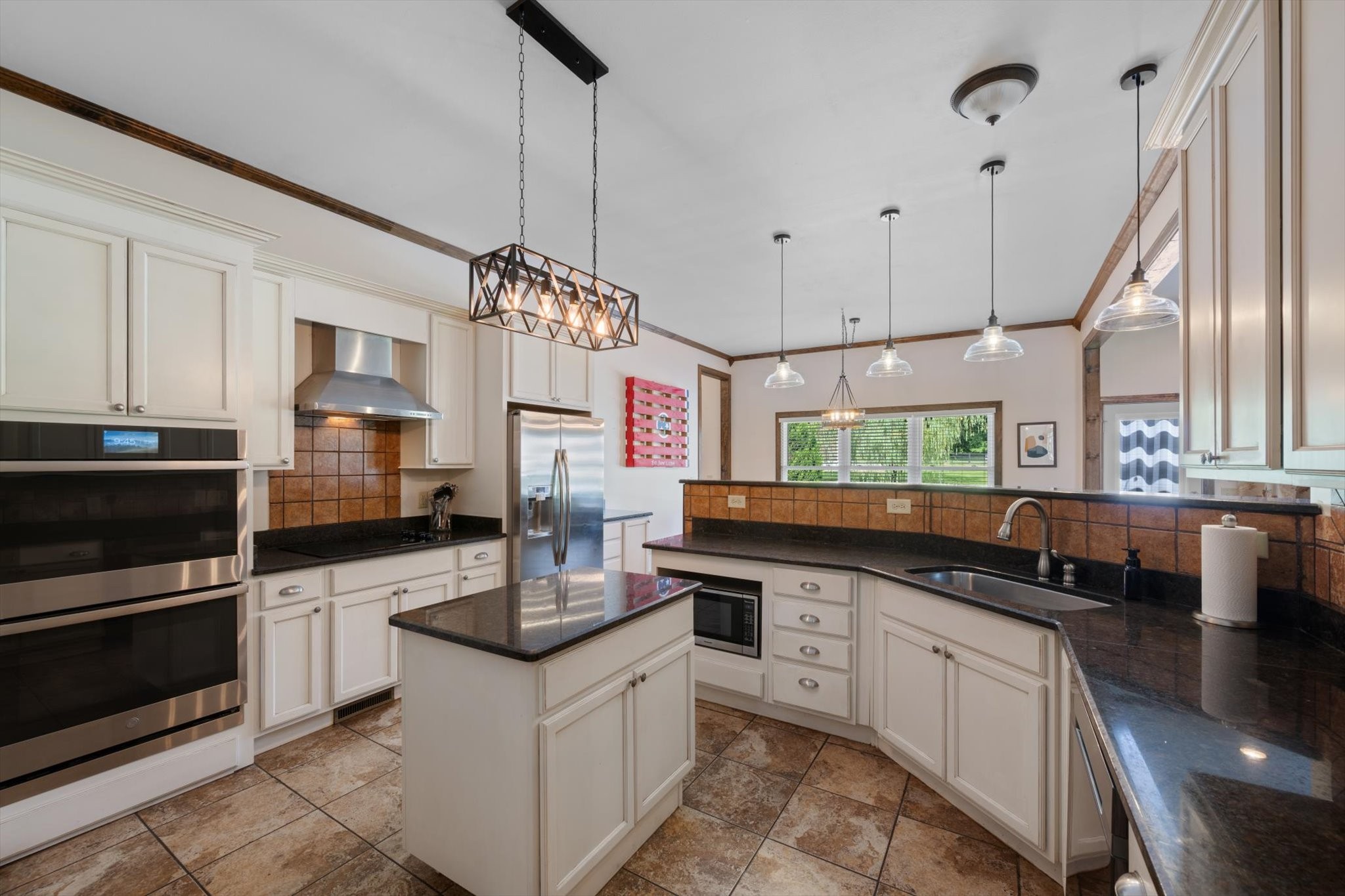 1779 Sedberry Road Franklin, TN 37064 - Photo 40 of 71 a kitchen with stainless steel appliances granite countertop a stove a sink and a microwave