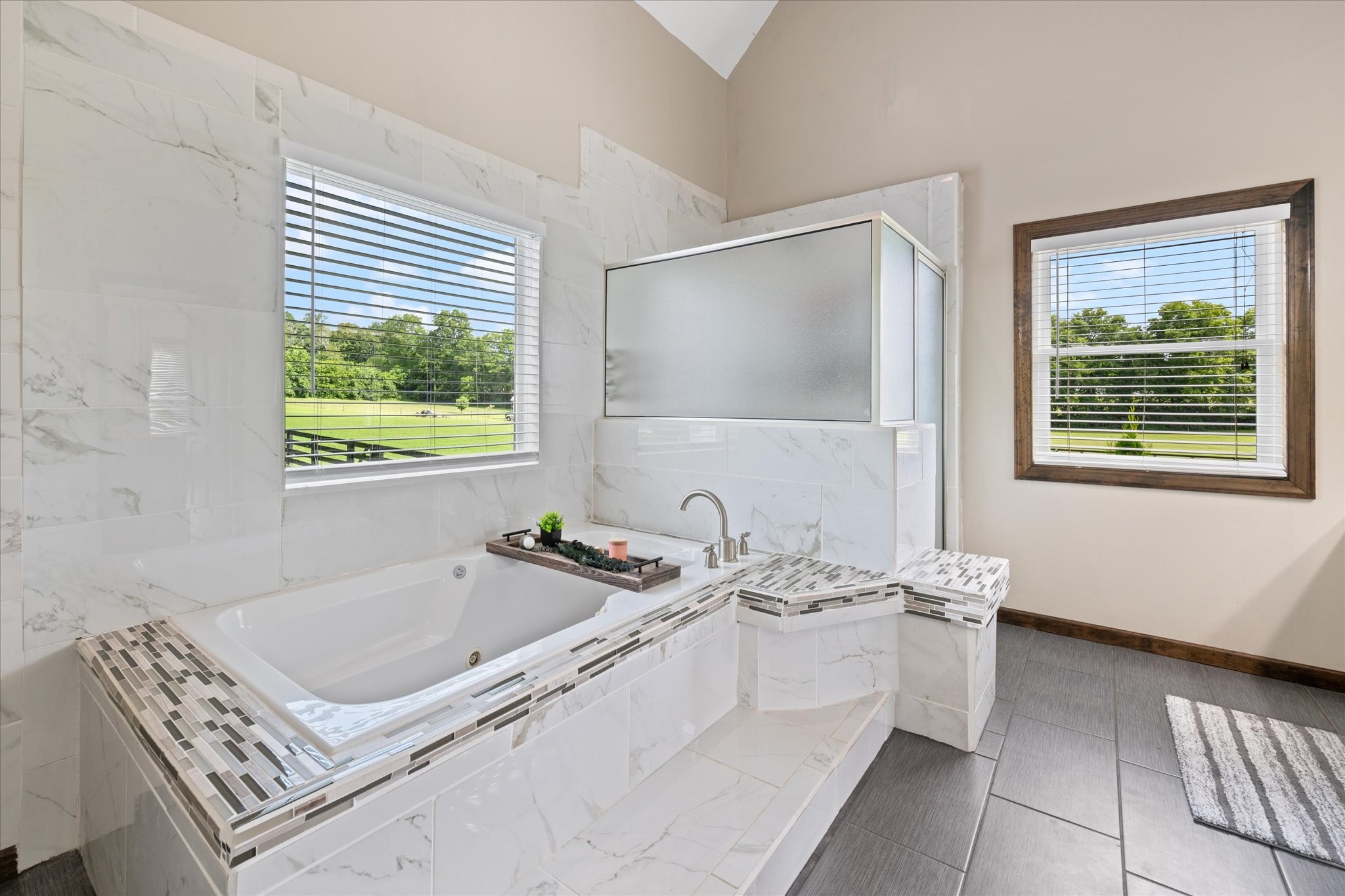 1779 Sedberry Road Franklin, TN 37064 - Photo 48 of 71 a bathroom with a tub a sink and a window