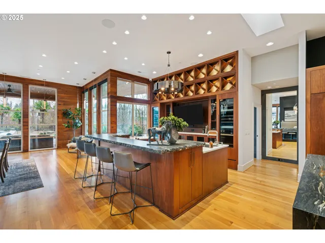 a living room with furniture and large windows