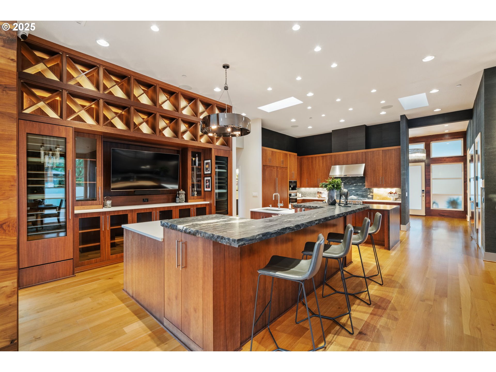 6730 Northwest Longbow Lane Camas, WA 98607 - Photo 20 of 45 a open kitchen with stainless steel appliances kitchen island granite countertop a large kitchen island a stove and a sink