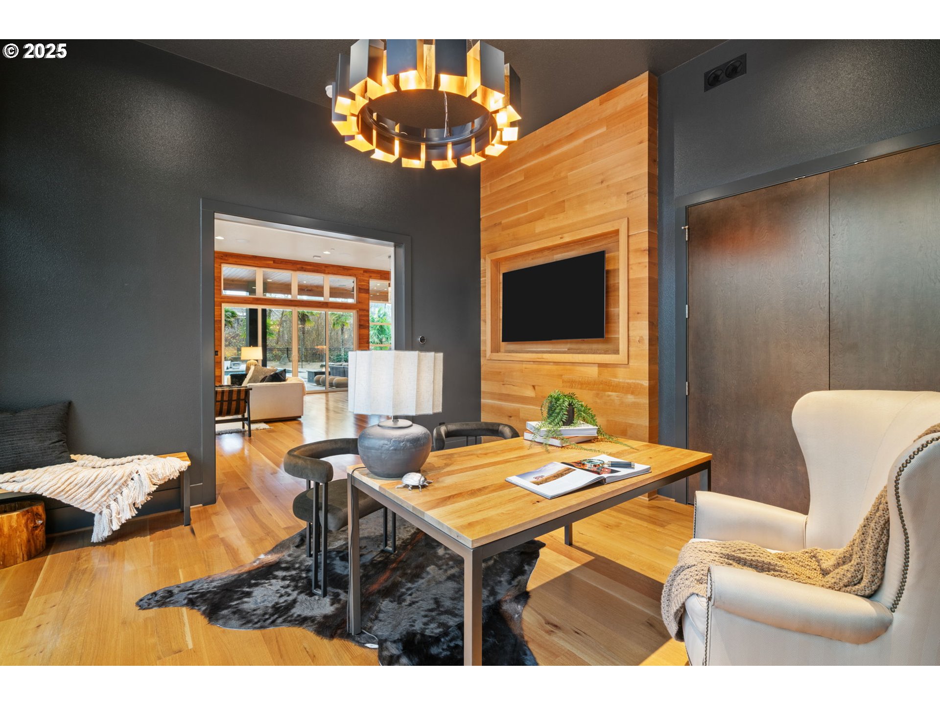 6730 Northwest Longbow Lane Camas, WA 98607 - Photo 28 of 45 a living room with furniture a chandelier and a dining table