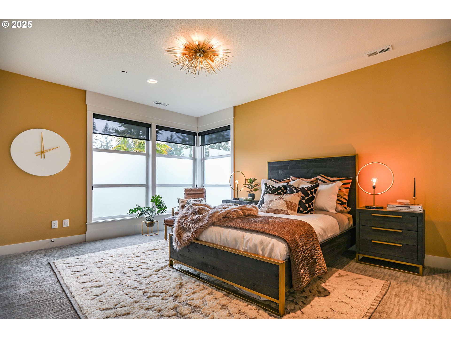 6730 Northwest Longbow Lane Camas, WA 98607 - Photo 31 of 45 a bedroom with a bed and a chandelier