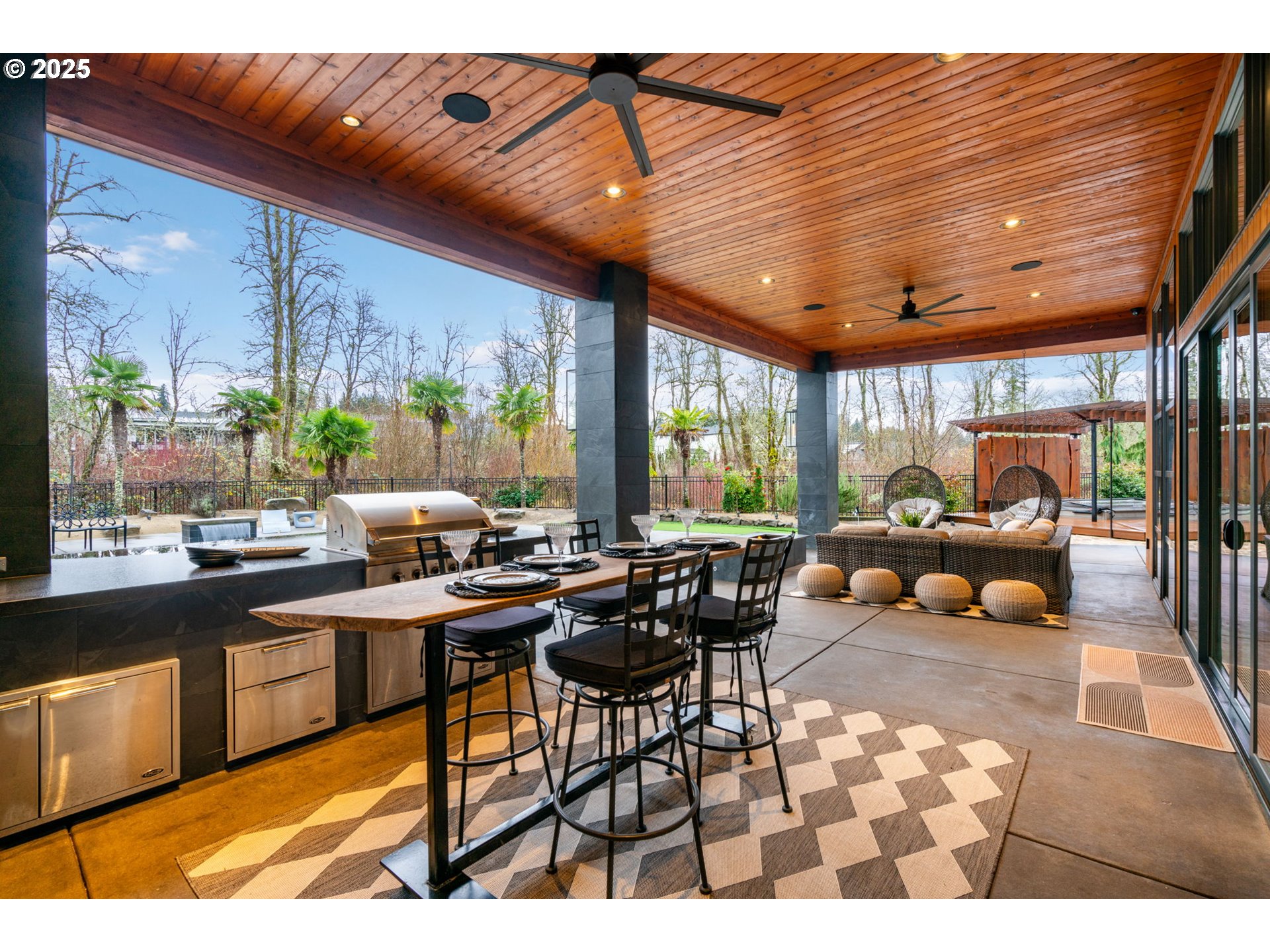 6730 Northwest Longbow Lane Camas, WA 98607 - Photo 38 of 45 a living room with furniture a rug and a large window