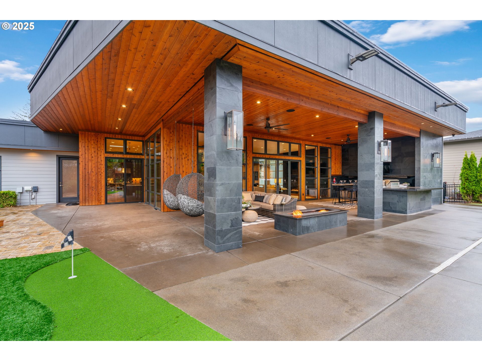6730 Northwest Longbow Lane Camas, WA 98607 - Photo 43 of 45 a view of a patio with a table and chairs under an umbrella