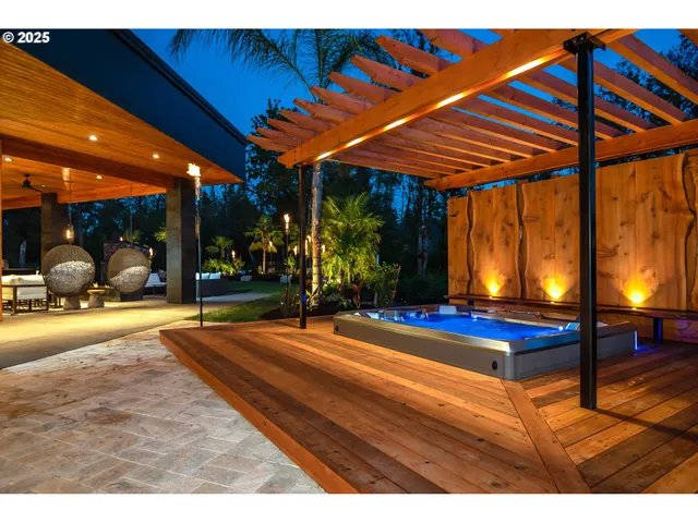 a view of a patio with a table and chairs under an umbrella