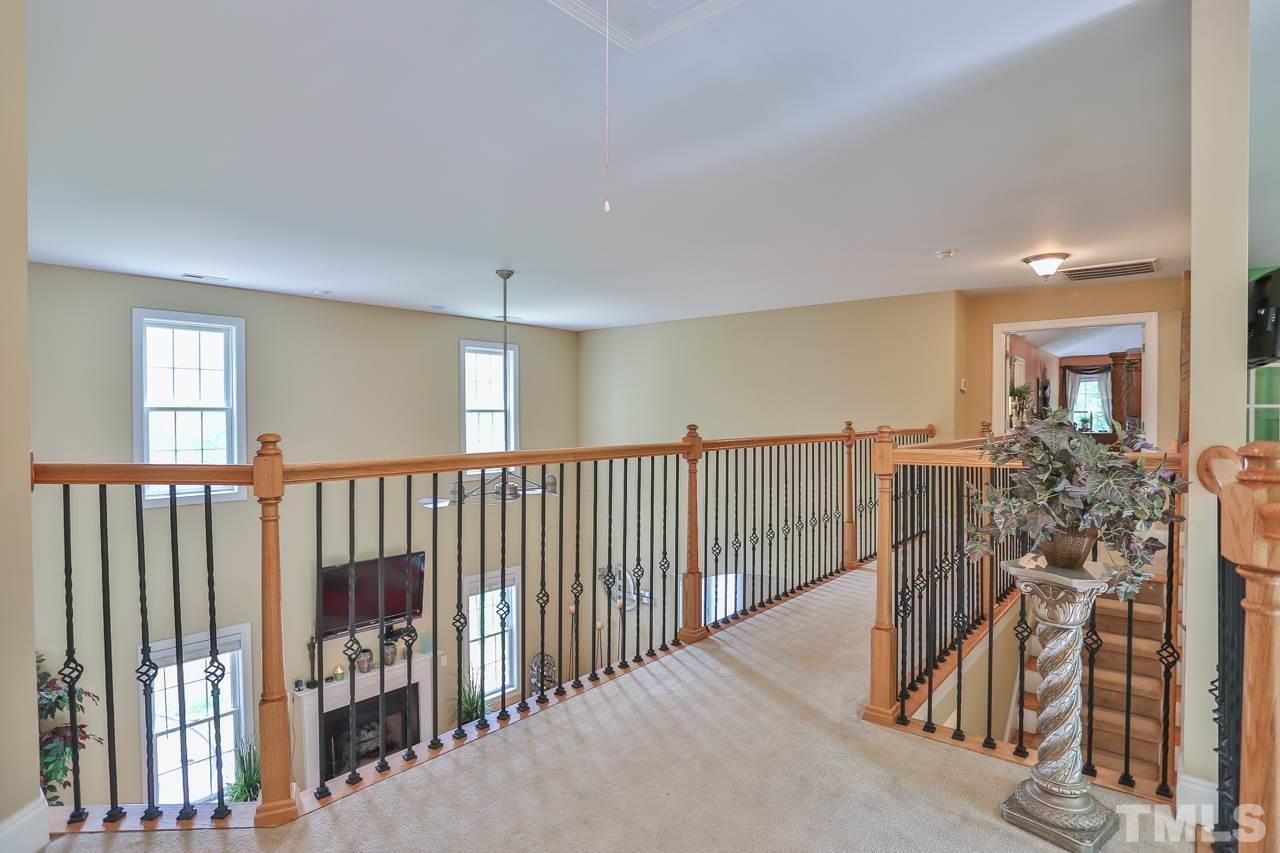 6448 Guess Road Durham, NC 27712 - Photo 12 of 23 a view of entryway with wooden floor