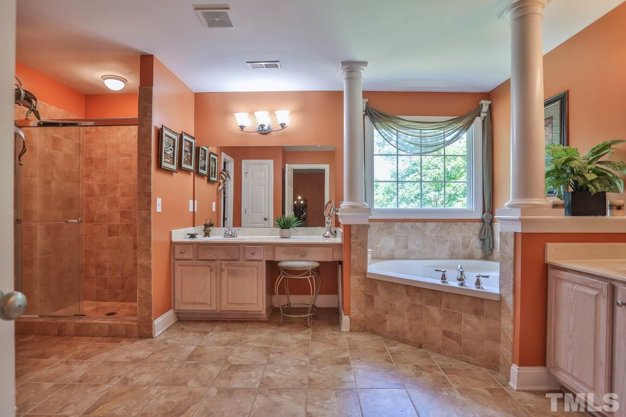 6448 Guess Road Durham, NC 27712 - Photo 15 of 23 a large spacious bathroom with a large tub shower and sink