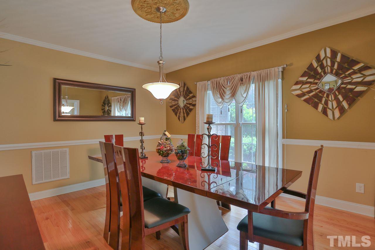 6448 Guess Road Durham, NC 27712 - Photo 3 of 23 a view of a dining room with furniture window and outside view
