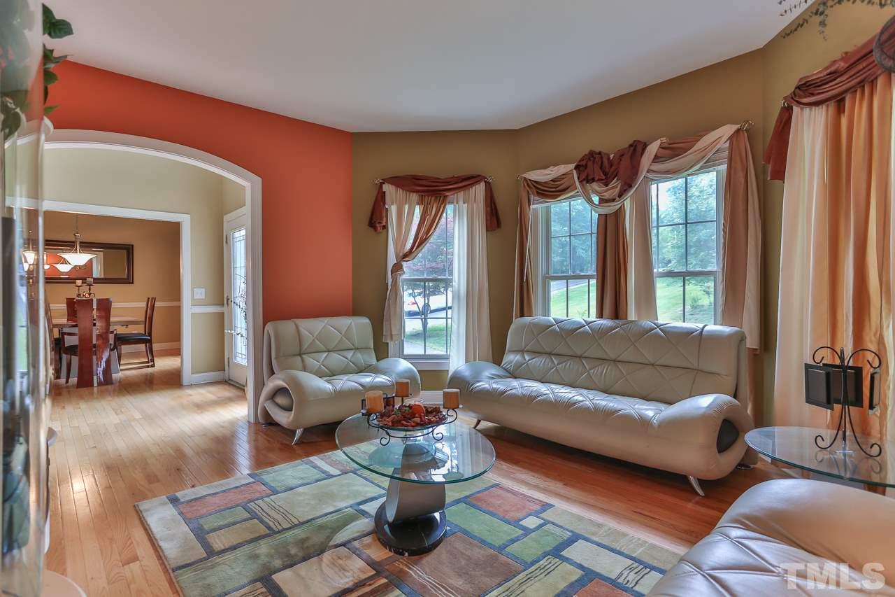 6448 Guess Road Durham, NC 27712 - Photo 4 of 23 a living room with furniture and a large window
