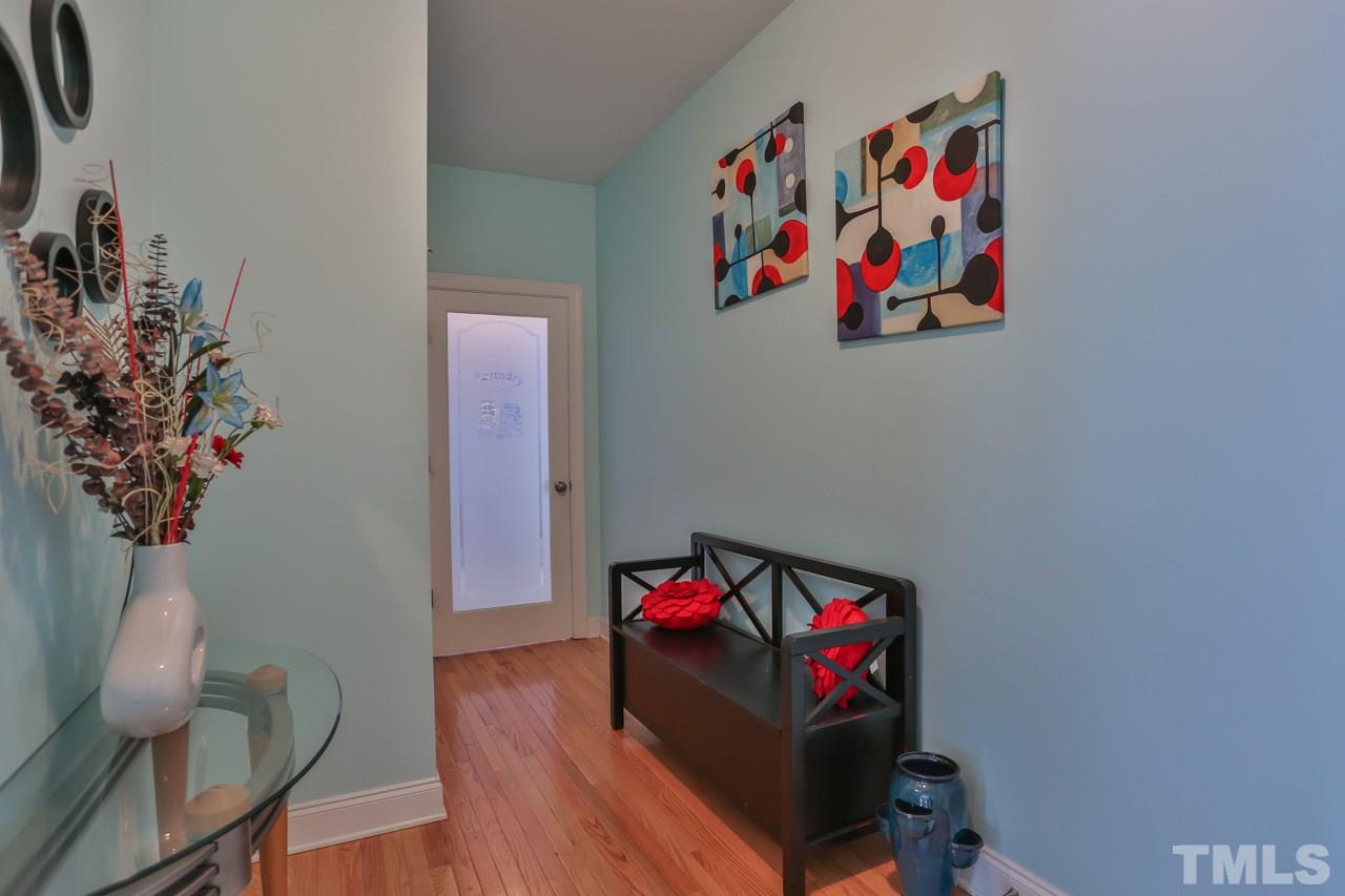 6448 Guess Road Durham, NC 27712 - Photo 8 of 23 a living room with furniture and a potted plant
