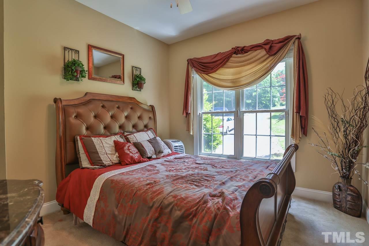 6448 Guess Road Durham, NC 27712 - Photo 10 of 23 a bedroom with a bed and a window