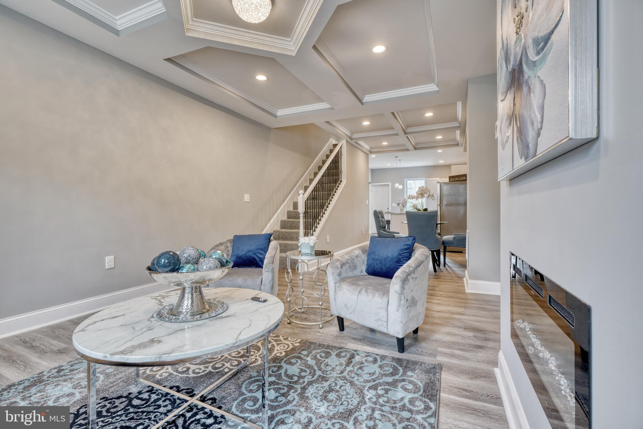 1506 North Wolfe Street Baltimore, MD 21213 - Photo 8 of 9 a living room with furniture and a dining table