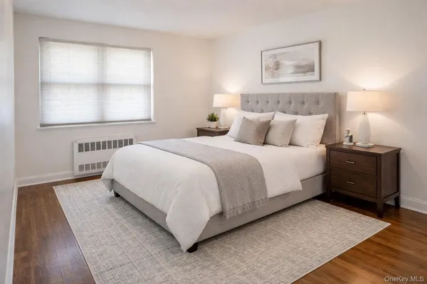 a view of a dining room with furniture wooden floor and chandelier