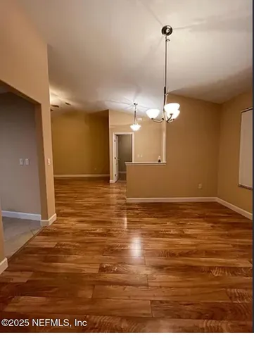 a view of a room with a ceiling fan