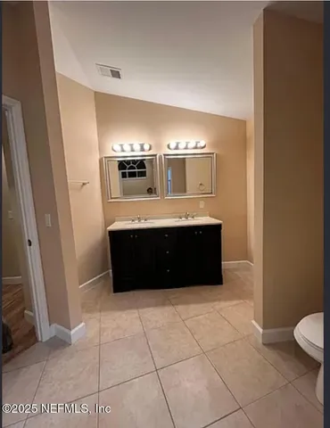 a bathroom with a bathtub and a sink