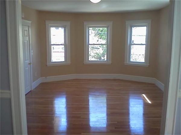 93 Rossmore Road, Unit 2 Boston, MA 02130 - Photo 1 of 1 a view of empty room with wooden floor and fan