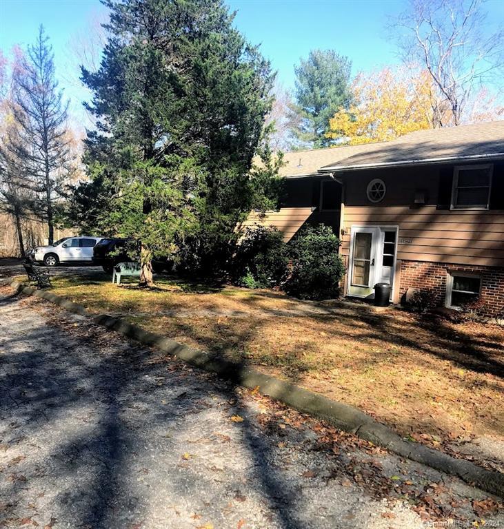 a view of a house with a yard