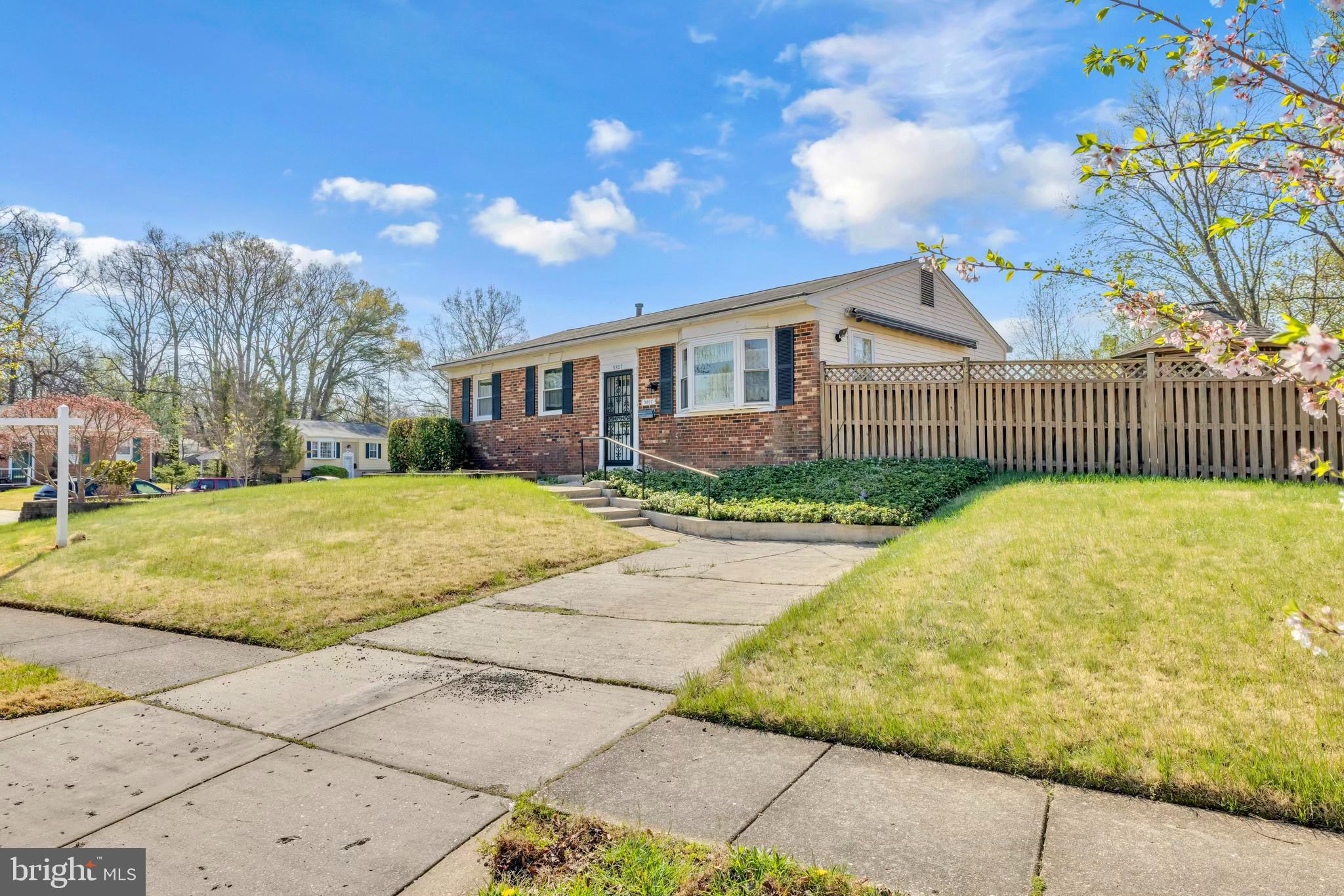 9807 Locust Avenue Lanham, MD 20706 - Photo 1 of 59 a view of a house with a yard