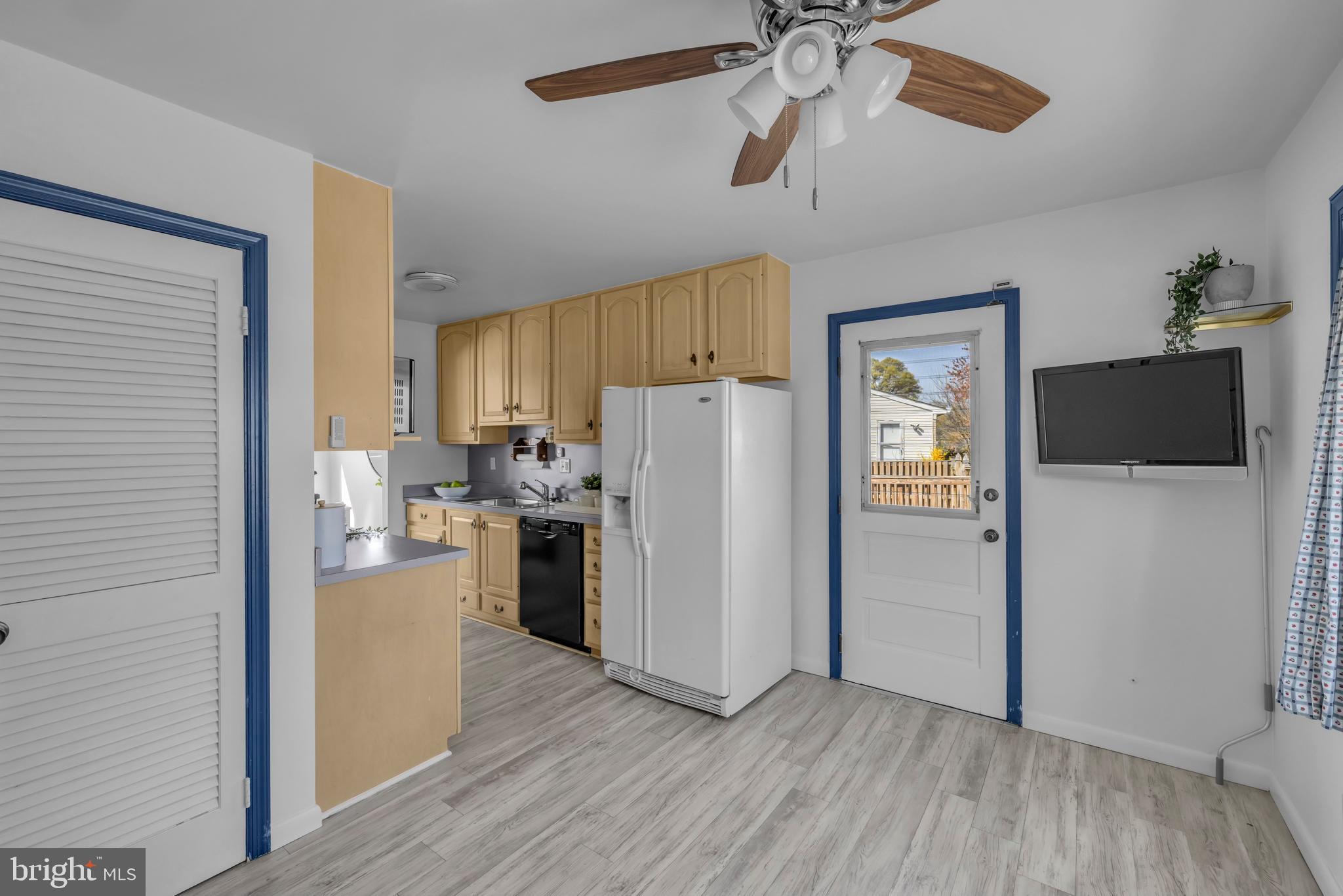 9807 Locust Avenue Lanham, MD 20706 - Photo 12 of 59 a view of a kitchen from a hallway