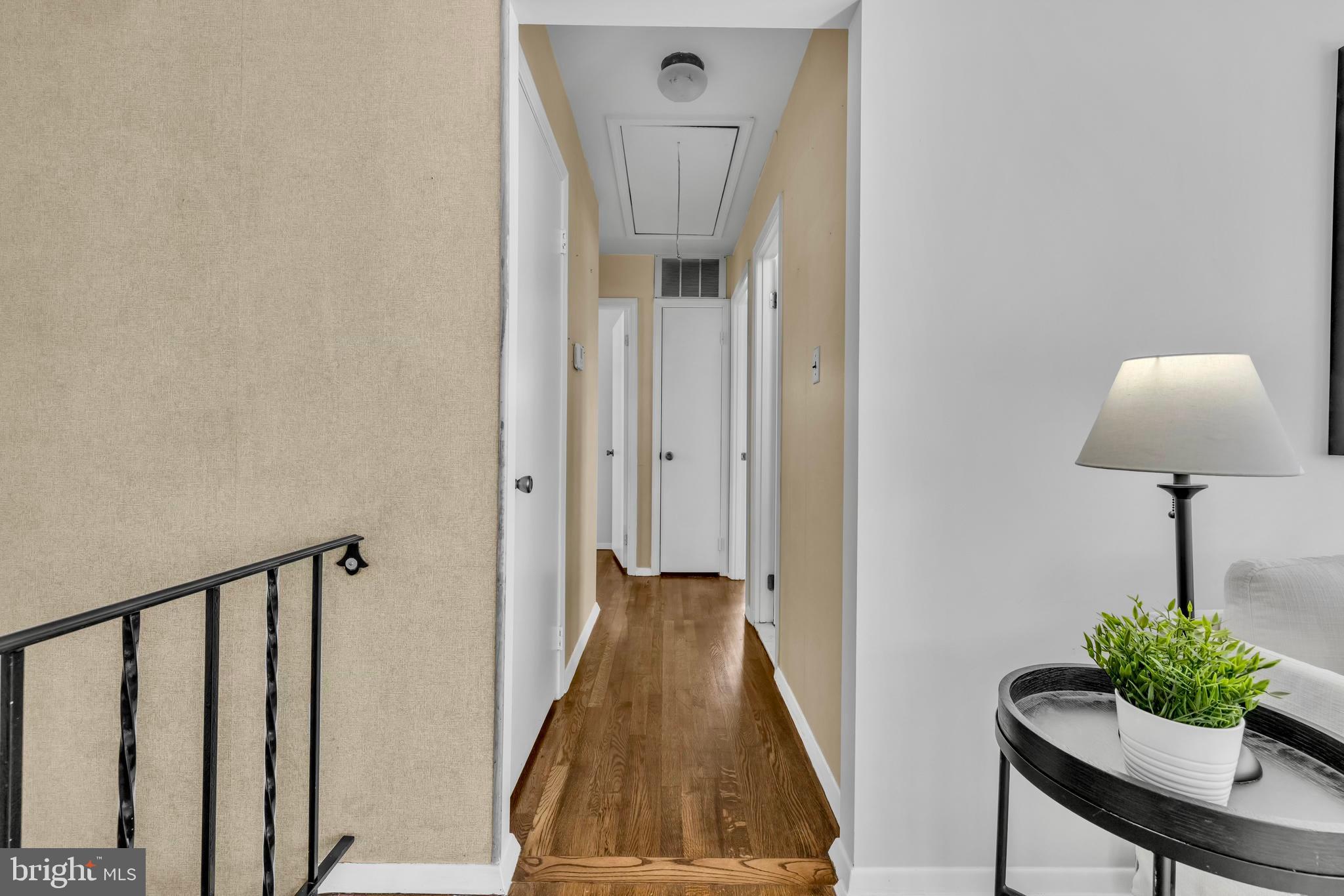 9807 Locust Avenue Lanham, MD 20706 - Photo 21 of 59 a view of a hallway with a potted plant