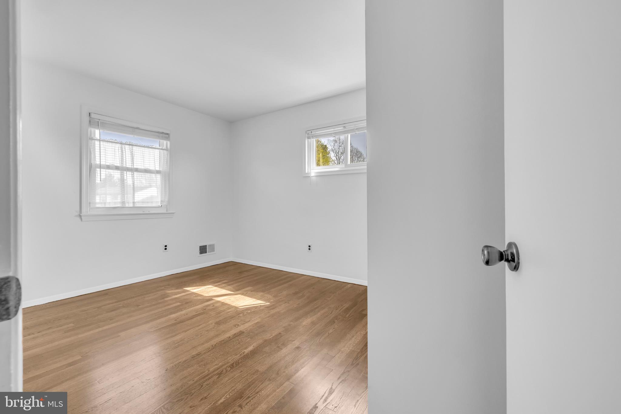 9807 Locust Avenue Lanham, MD 20706 - Photo 24 of 59 an empty room with windows