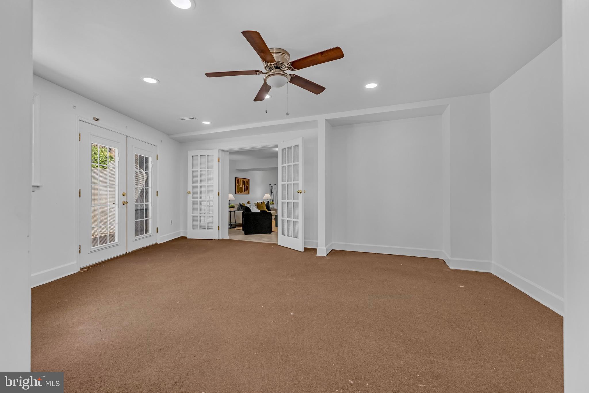 9807 Locust Avenue Lanham, MD 20706 - Photo 35 of 59 a view of an empty room with a ceiling fan