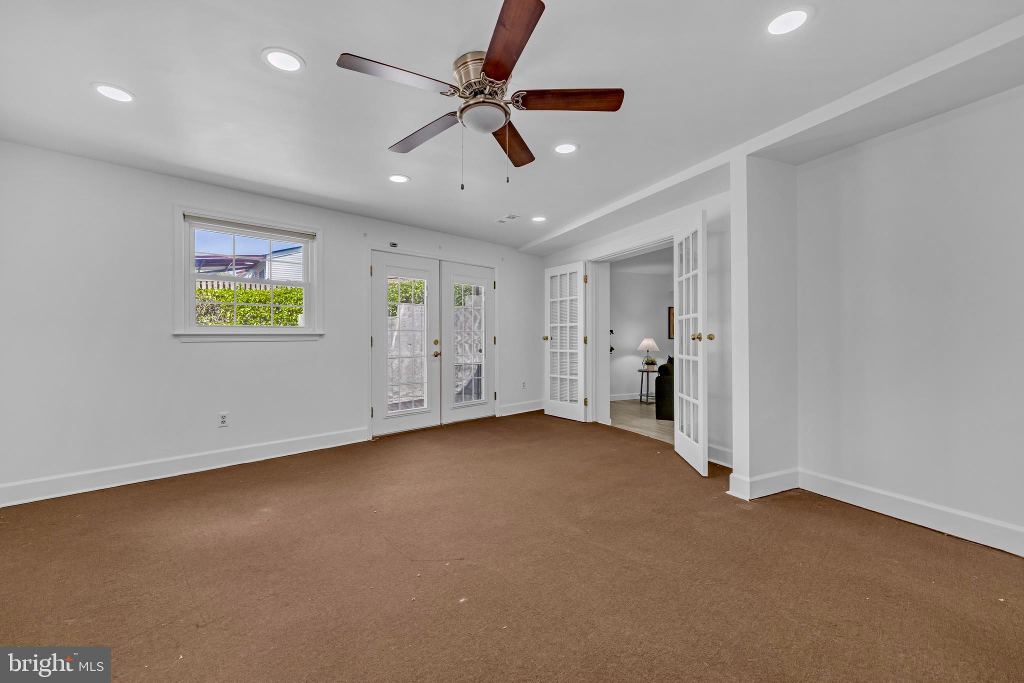 9807 Locust Avenue Lanham, MD 20706 - Photo 36 of 59 a view of an empty room with a window