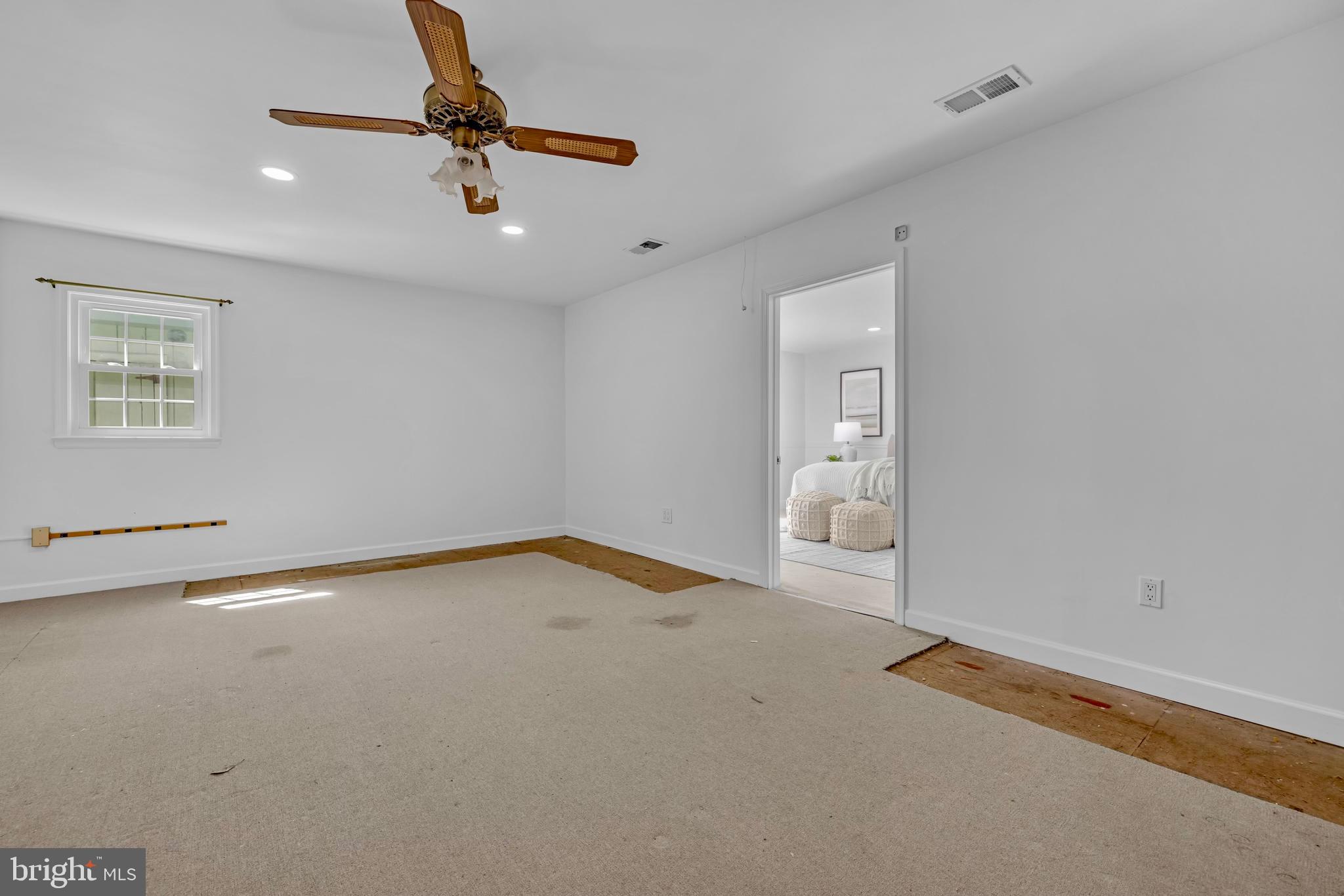 9807 Locust Avenue Lanham, MD 20706 - Photo 42 of 59 wooden floor in an empty room with a window