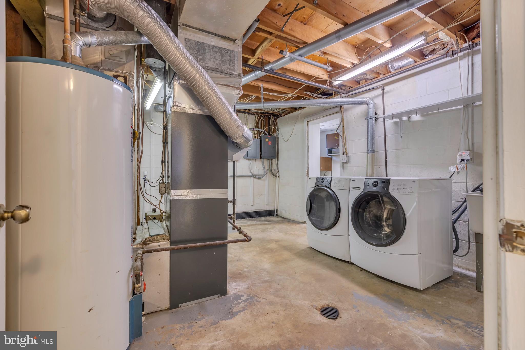 9807 Locust Avenue Lanham, MD 20706 - Photo 44 of 59 a utility room with dryer and washer