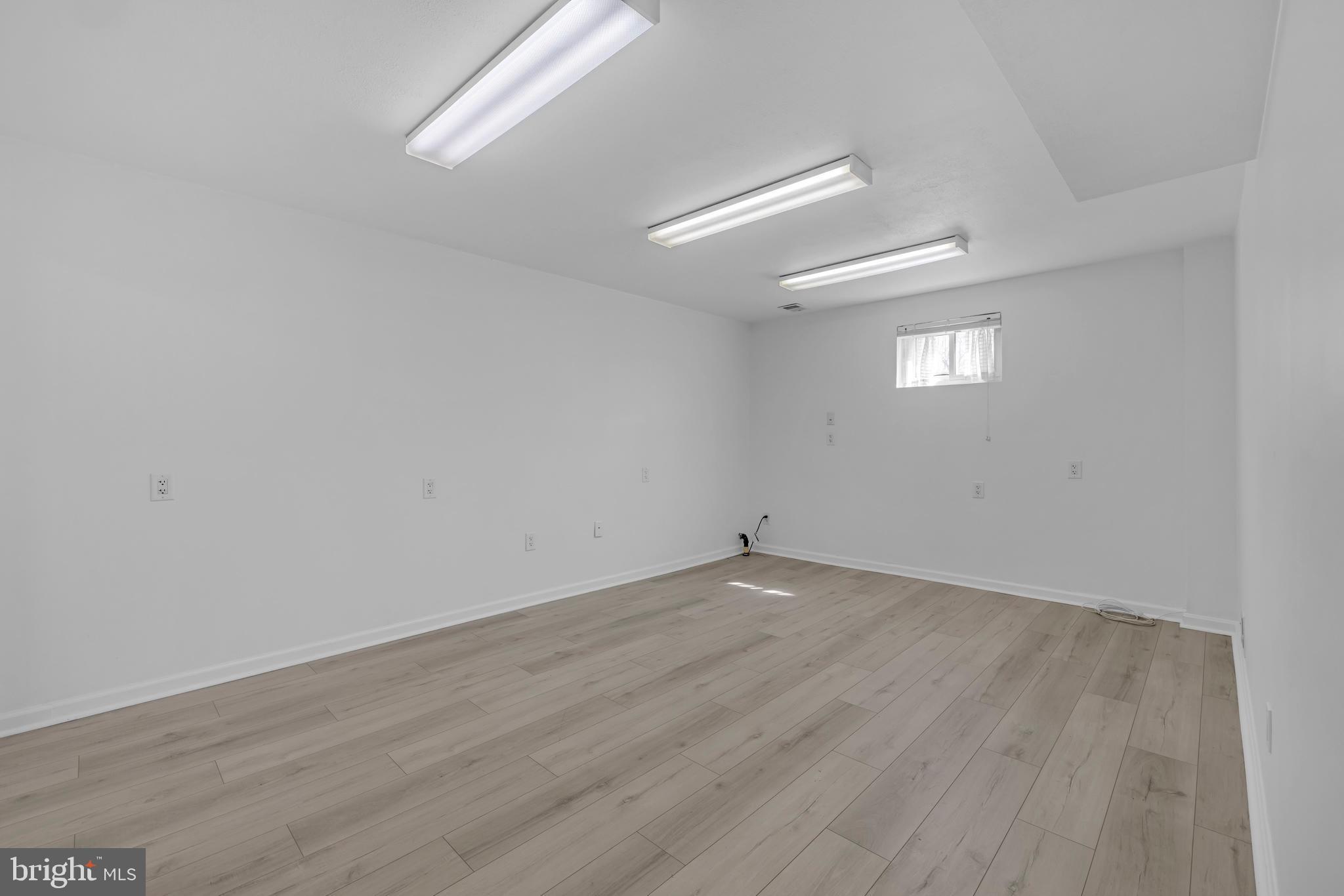9807 Locust Avenue Lanham, MD 20706 - Photo 45 of 59 wooden floor in a empty room