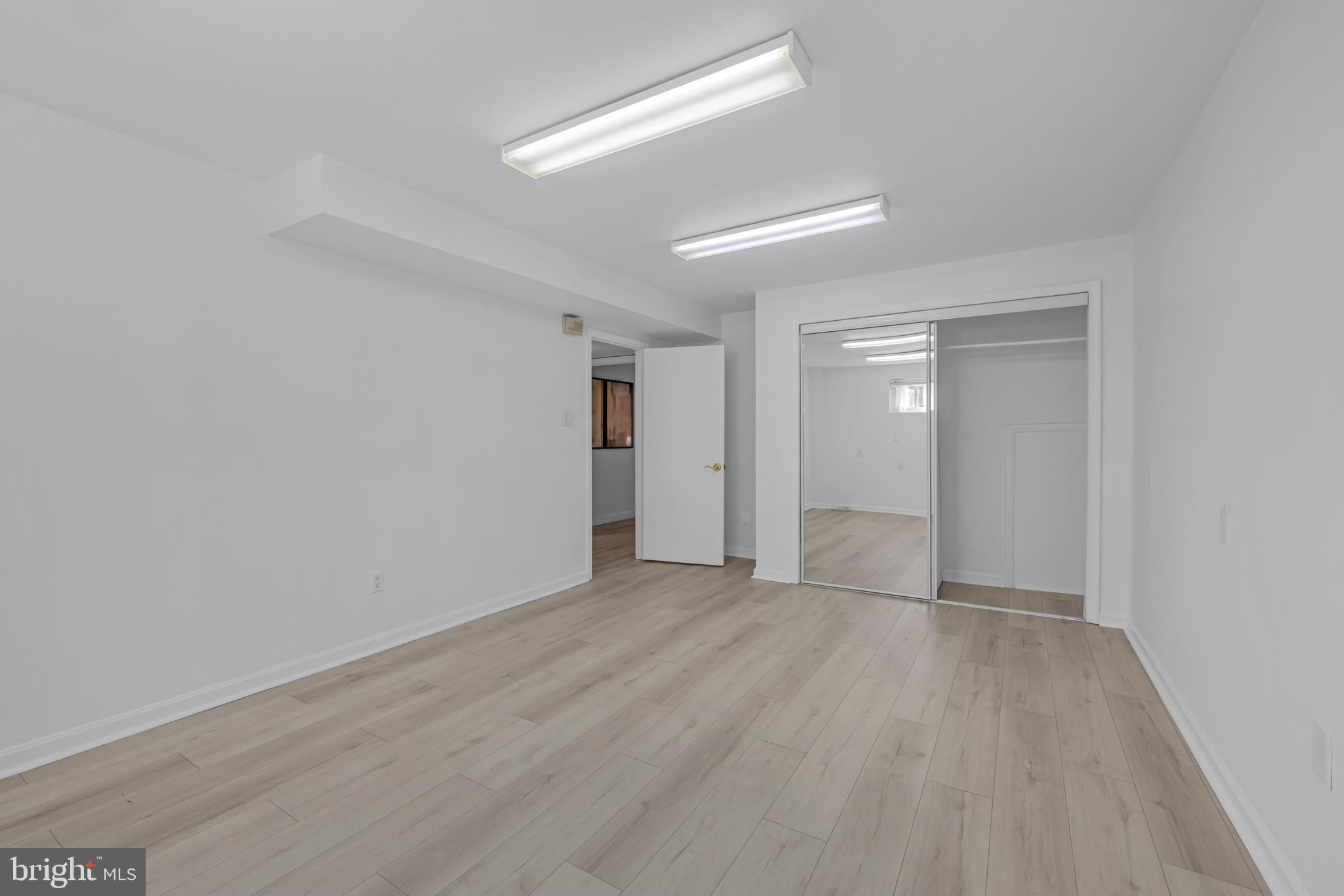 9807 Locust Avenue Lanham, MD 20706 - Photo 46 of 59 wooden floor in an empty room