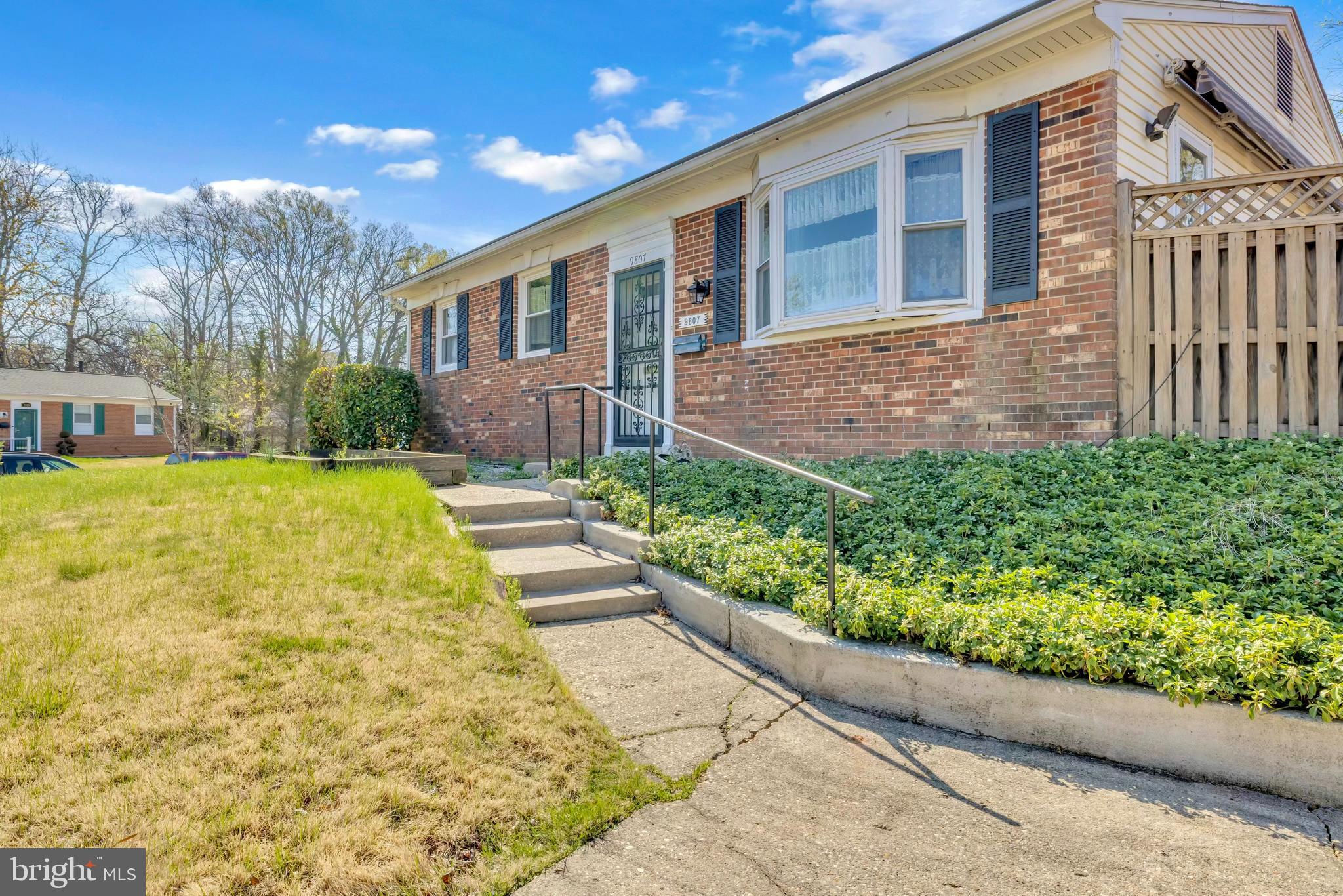 9807 Locust Avenue Lanham, MD 20706 - Photo 5 of 59 a view of a house with a yard