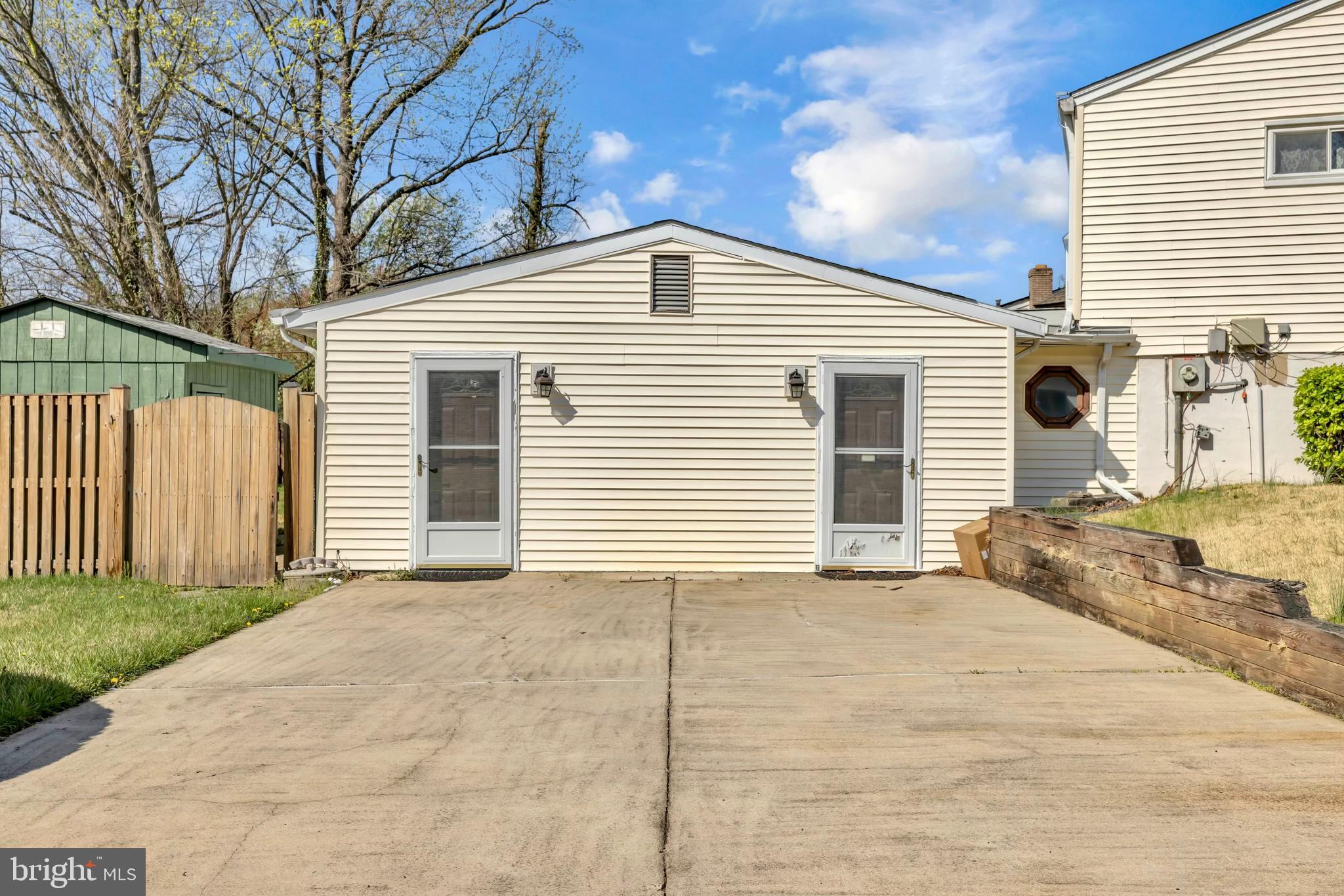 9807 Locust Avenue Lanham, MD 20706 - Photo 7 of 59 a view of a white house with a large space