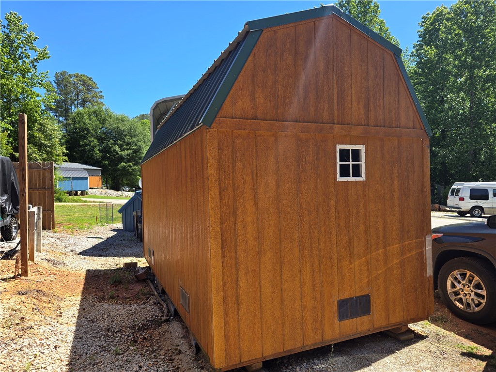 131 Loop Circle Westminster, SC 29693 - Photo 11 of 17 This outdoor storage shed offers versatile utility with a classic design and durable construction.