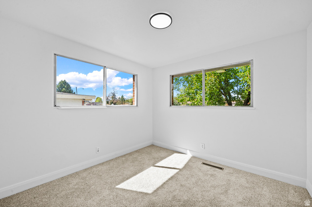 2267 West 4350th Street South Roy, UT 84067 - Photo 20 of 32 Spare room with baseboards and carpet