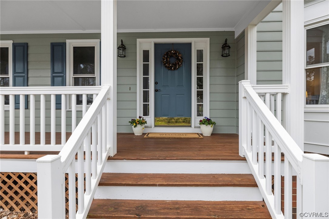 5716 Sandstone Ridge Road Midlothian, VA 23112 - Photo 2 of 36 a view of staircase with railing and a chandelier
