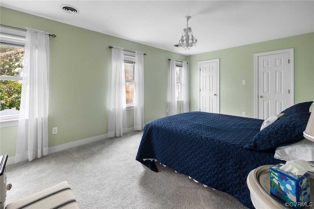5716 Sandstone Ridge Road Midlothian, VA 23112 - Photo 27 of 36 a bedroom with a bed a dresser and a window