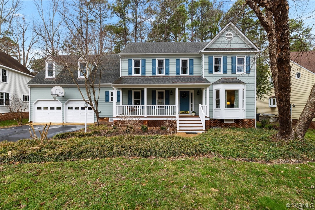5716 Sandstone Ridge Road Midlothian, VA 23112 - Photo 4 of 36 a front view of a house with a yard