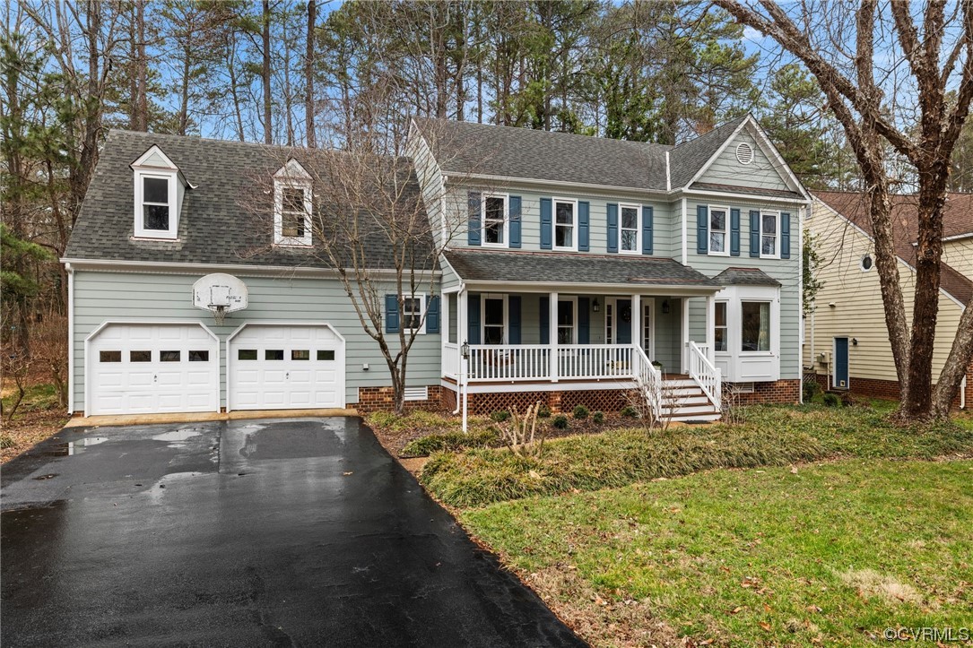 5716 Sandstone Ridge Road Midlothian, VA 23112 - Photo 5 of 36 a front view of a house with a yard