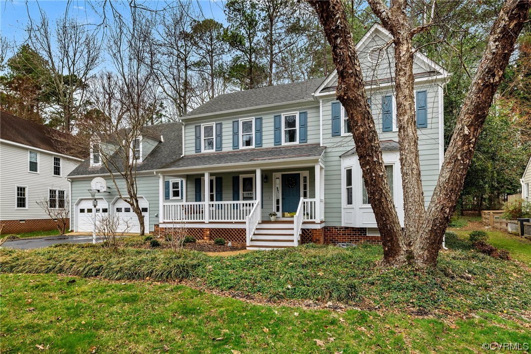 5716 Sandstone Ridge Road Midlothian, VA 23112 - Photo 6 of 36 a front view of a house with garden