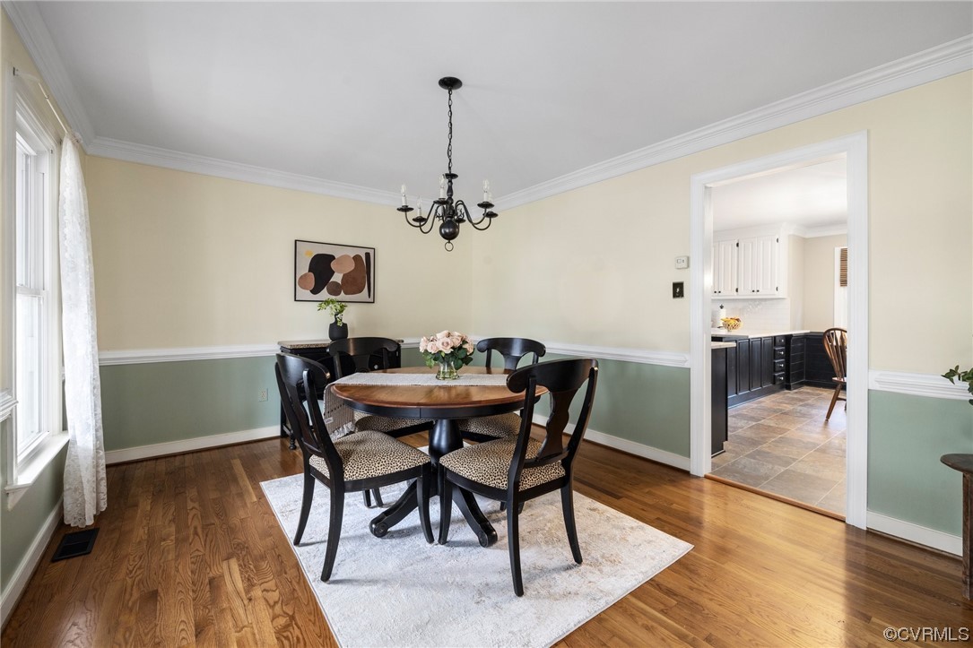 5716 Sandstone Ridge Road Midlothian, VA 23112 - Photo 8 of 36 a view of a dining room with furniture and wooden floor