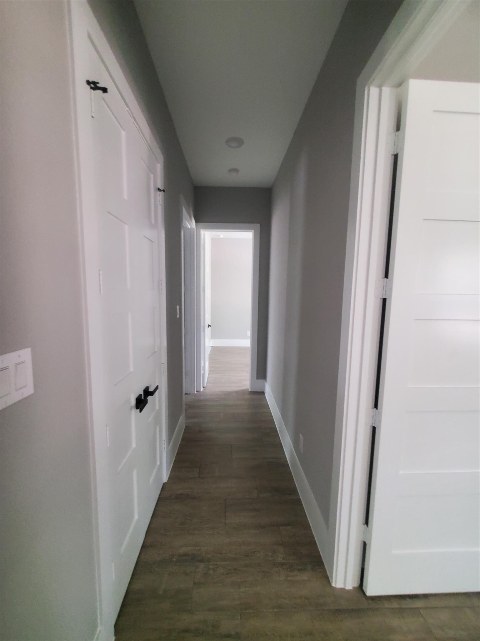 24647 Oak Creek Road Hockley, TX 77447 - Photo 11 of 47 a view of a hallway with wooden floor