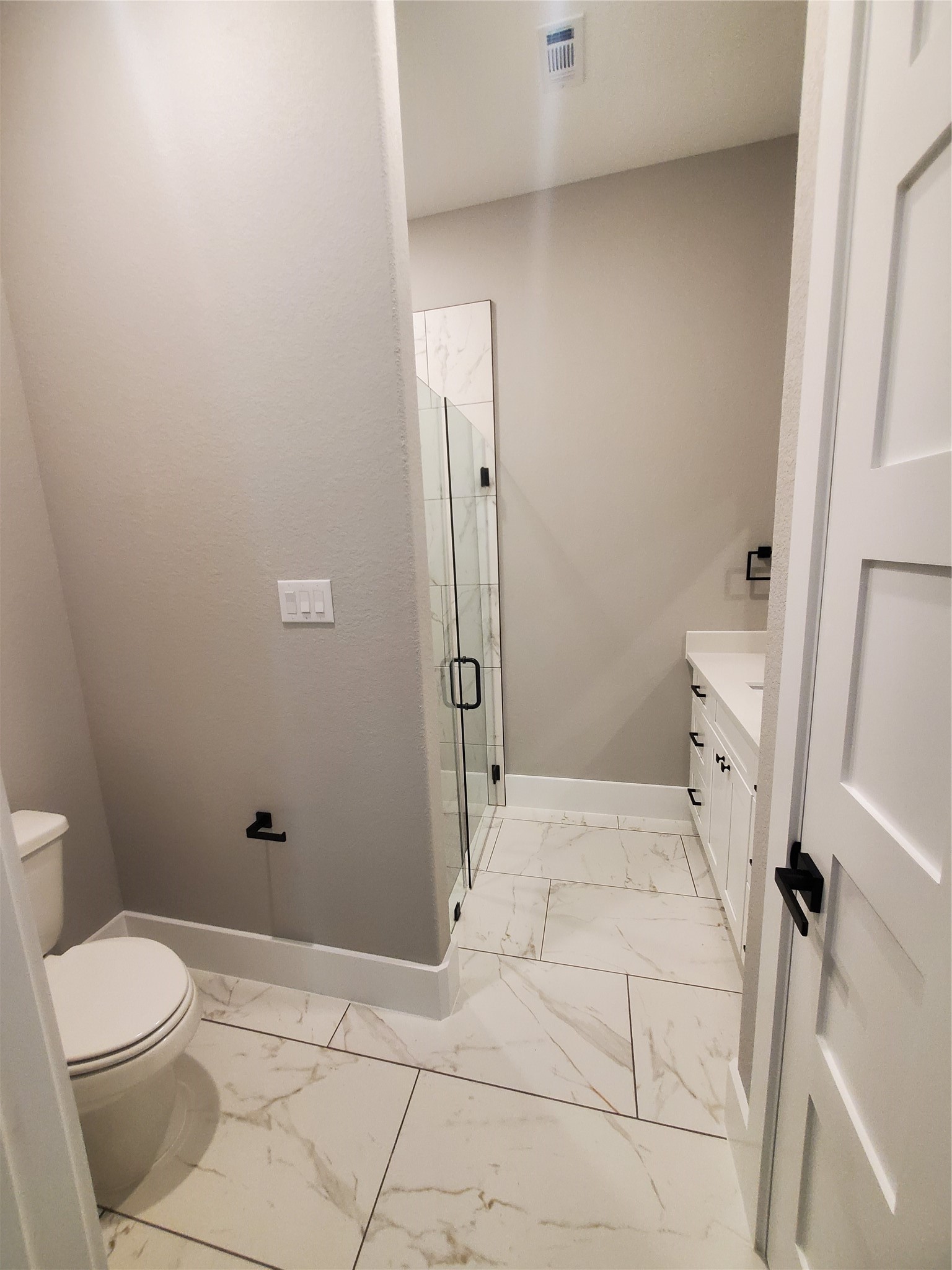 24647 Oak Creek Road Hockley, TX 77447 - Photo 19 of 47 a bathroom with a toilet and shower