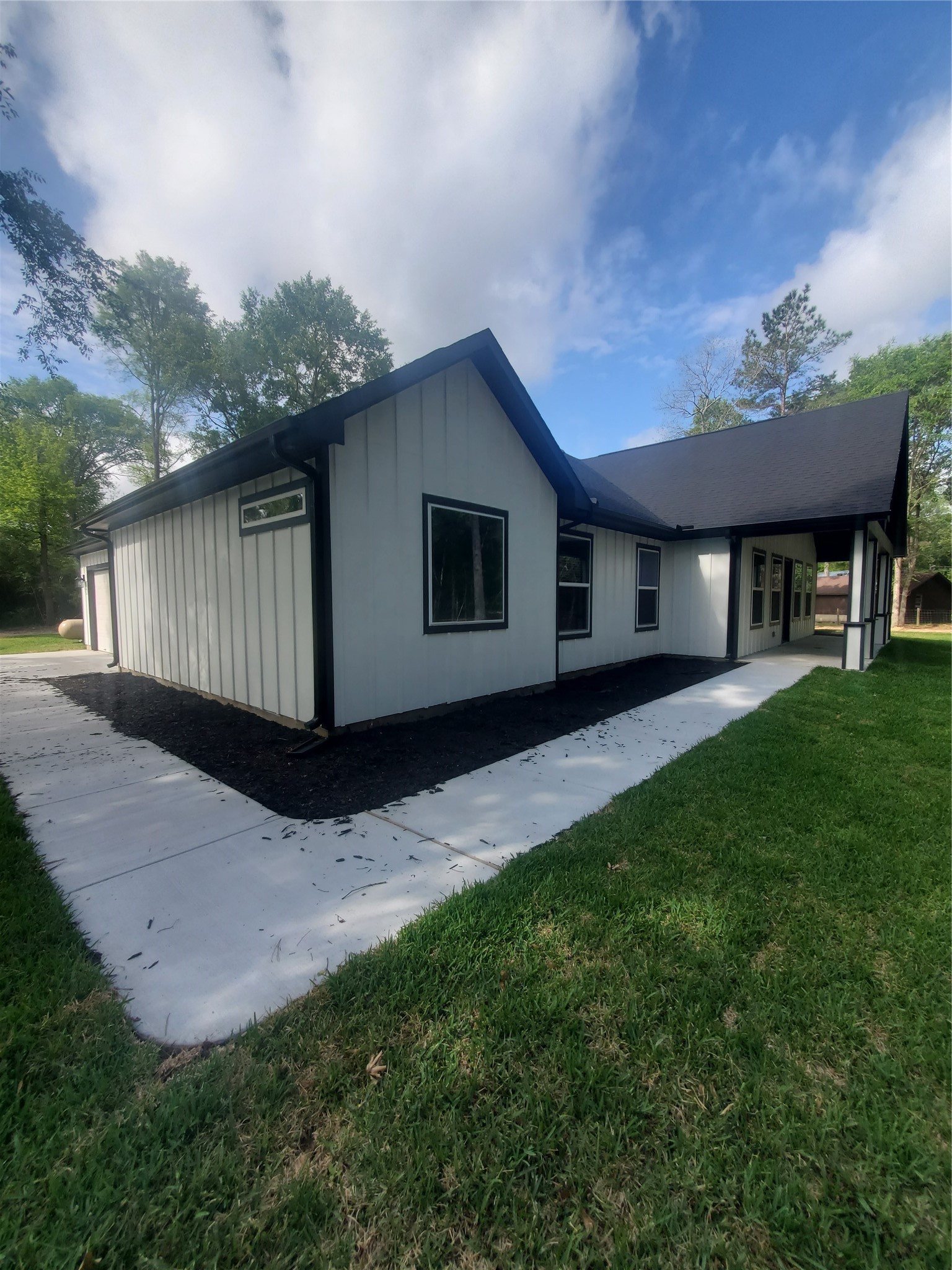 24647 Oak Creek Road Hockley, TX 77447 - Photo 2 of 47 a house view with a garden space