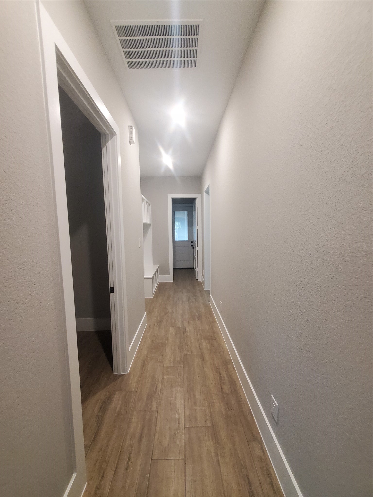 24647 Oak Creek Road Hockley, TX 77447 - Photo 23 of 47 a view of a hallway with wooden floor